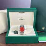 Rolex Oyster Perpetual 126000 Red Dial 36mm 1.jpg
